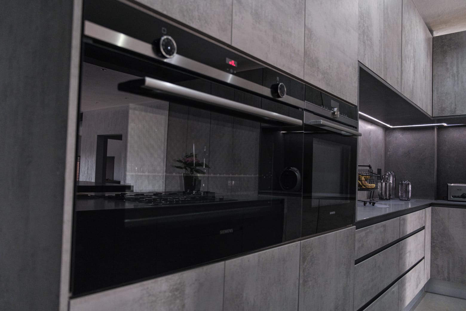 Close-up of integrated Siemens oven and appliances built into Pandors Designs cabinetry
